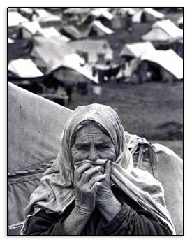 Refugee at her home - a refugee camp.